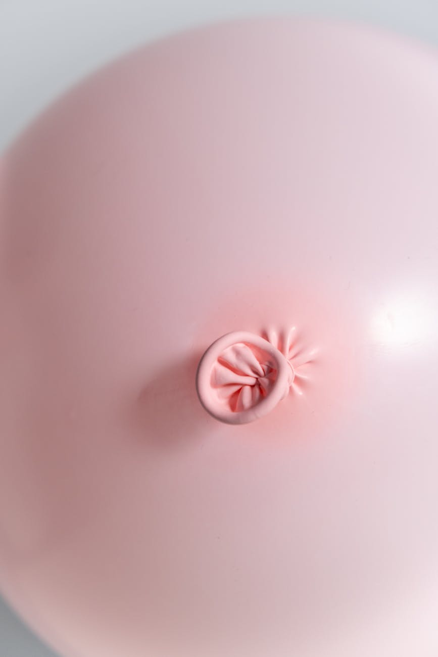 pink round ornament on white surface